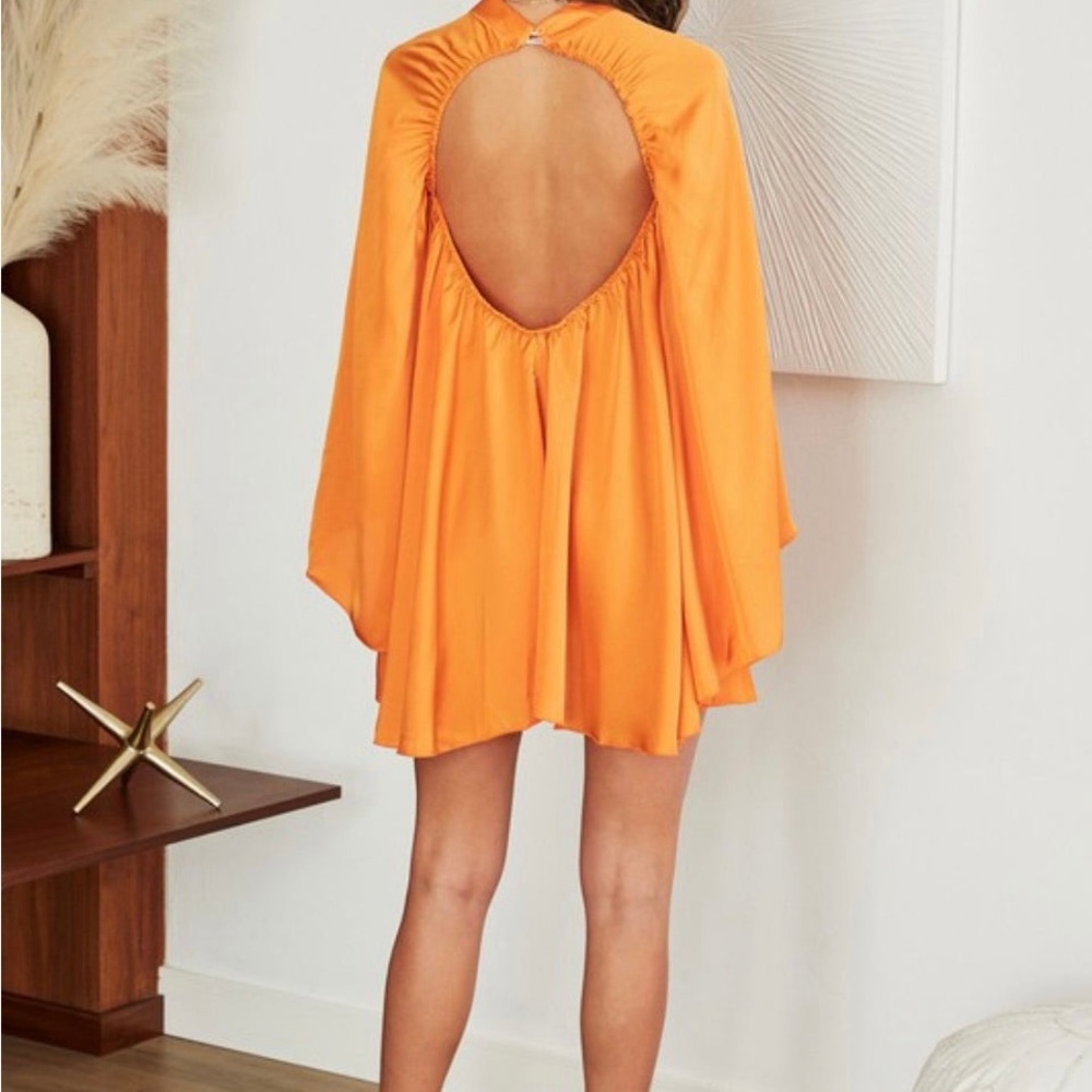 Solid Mock neck long bell sleeve wide keyhole on back. 100% Polyester